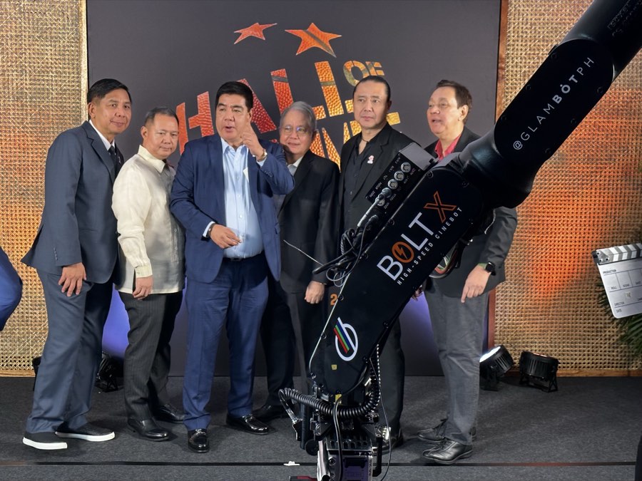 The Bolt X high-speed cinebot, branded GlamBot PH, framing officials on stage at the FIBA Hall of Fame Induction Night