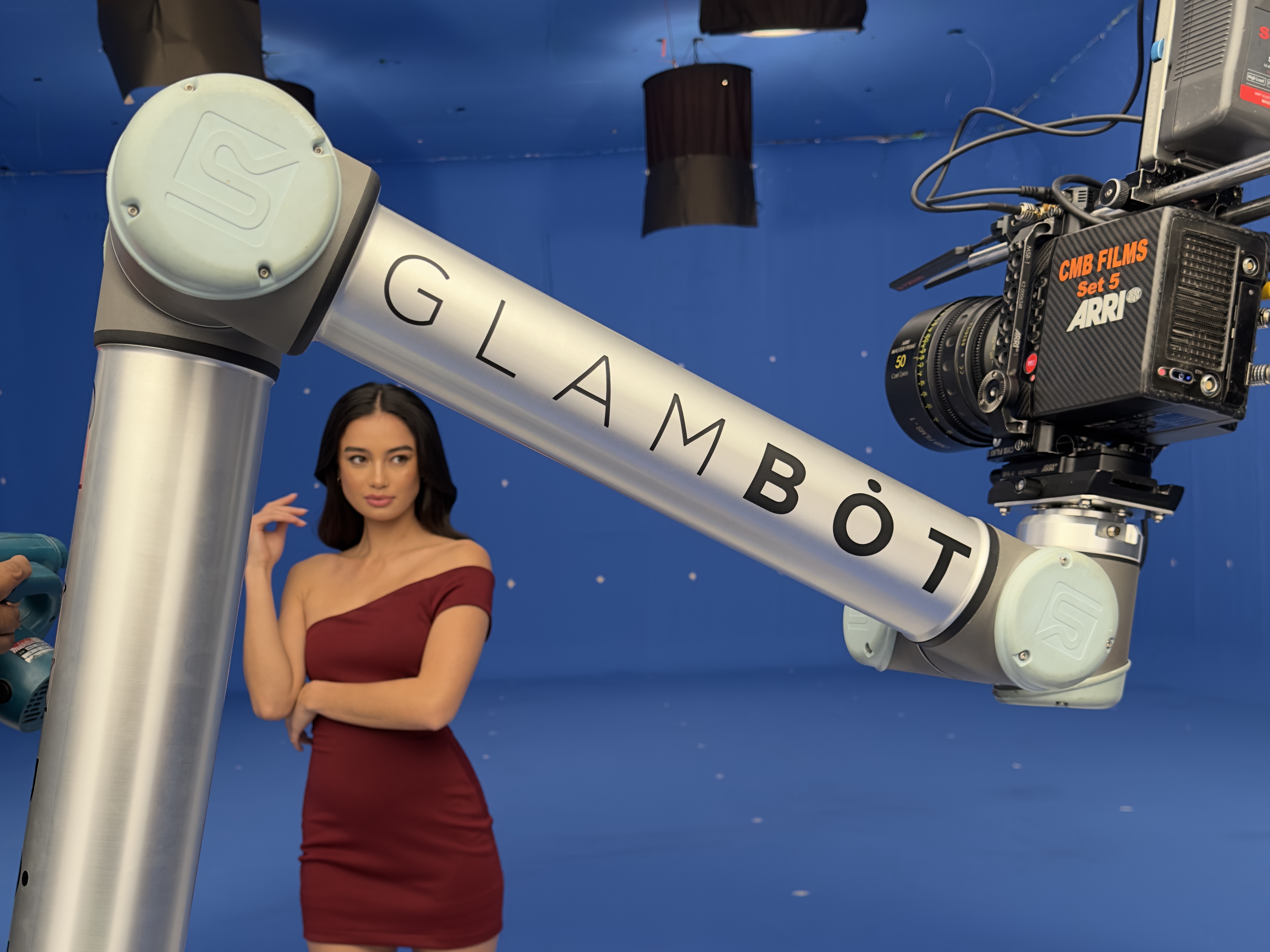 Kelsey Merritt on a blue-screen set with the GlamBot arm for a Myra Philippines TVC