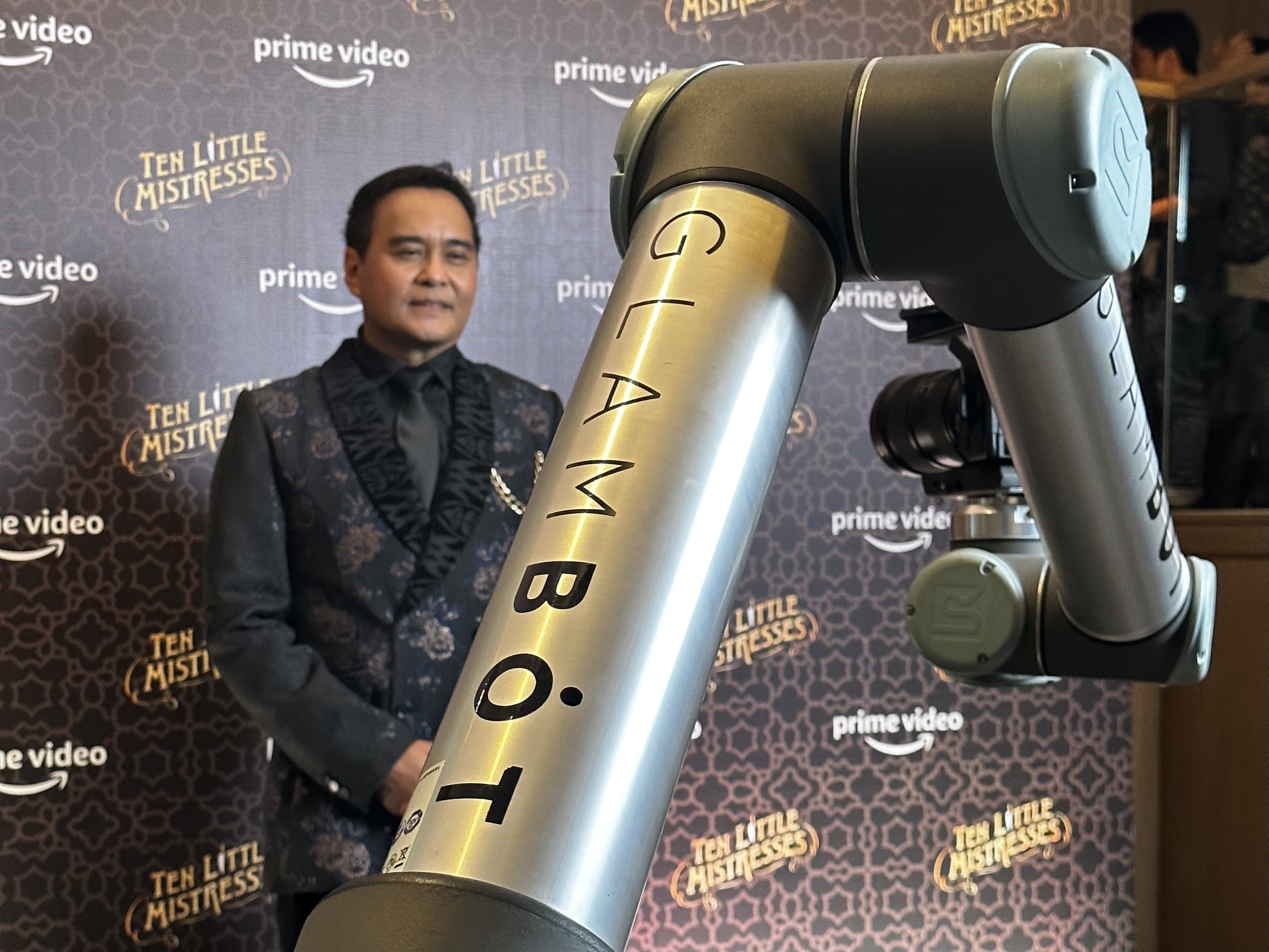 The GlamBot arm on the red carpet at the Amazon Prime Video Ten Little Mistresses premiere